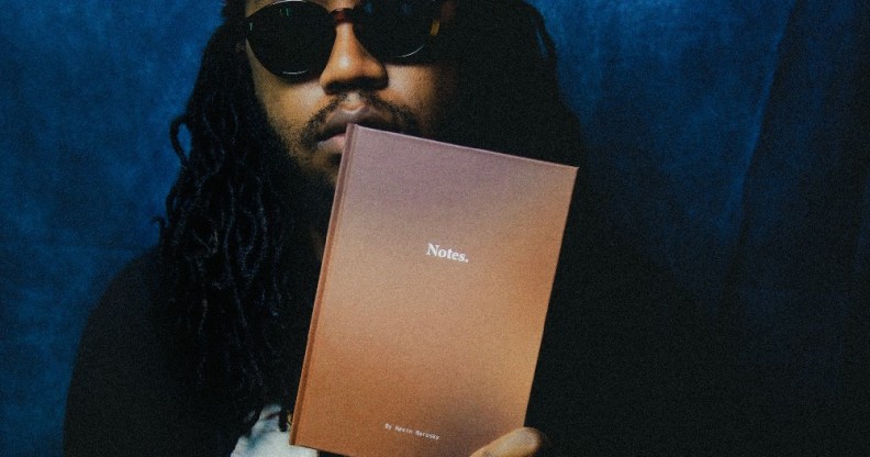 Kevin Morosky holding his book, Notes