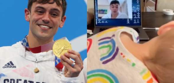 Tom Daley holding his Olympic gold medal / his son watching a video on a laptop of him