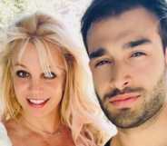 Britney Spears poses with her boyfriend Sam Asghari at their California home