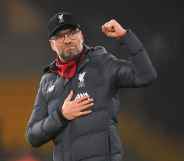 Liverpool manager Jürgen Klopp raises his fist in the air