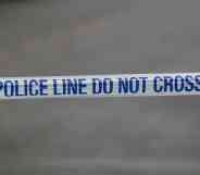 A police tape that reads 'police line do not cross'