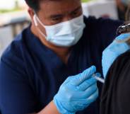 A nurse administers a dose of Covid-19 vaccine
