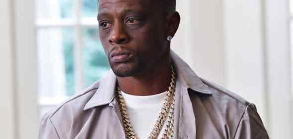 Boosie Badazz in a grey shirt and white t-shirt looking to the right