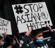 People participate in a protest to demand an end to anti-Asian violence in the US