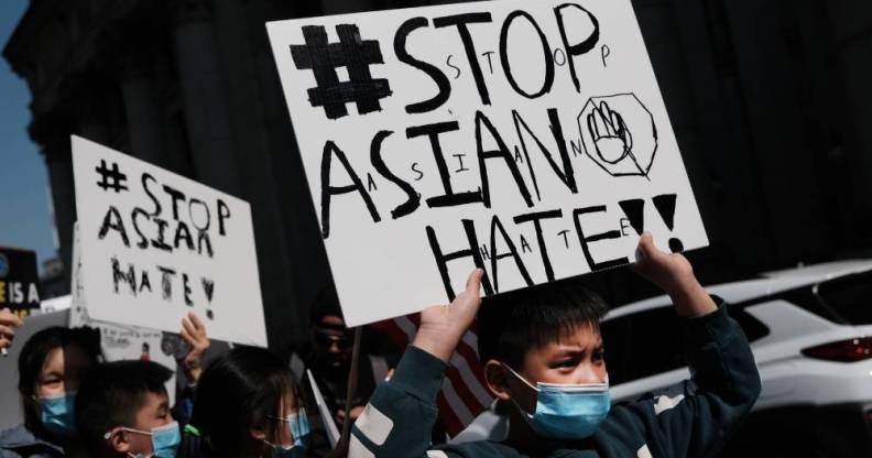 People participate in a protest to demand an end to anti-Asian violence in the US