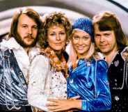 The four original members of ABBA posing for a photo together after winning the Eurovision Song Contest