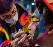 Pro-democracy activist Jimmy Sham Tsz-Kit getting his face painted in rainbow colours during 2020 Hong Kong Pride