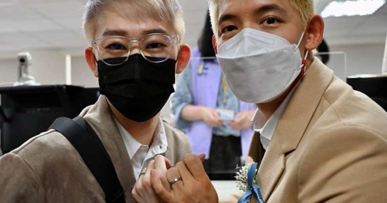 Tin Tse Yen (left) and Leong Chin-fai showing off their rings