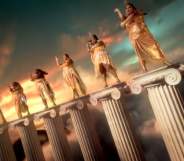 Lizzo and dancers standing atop Greek columns