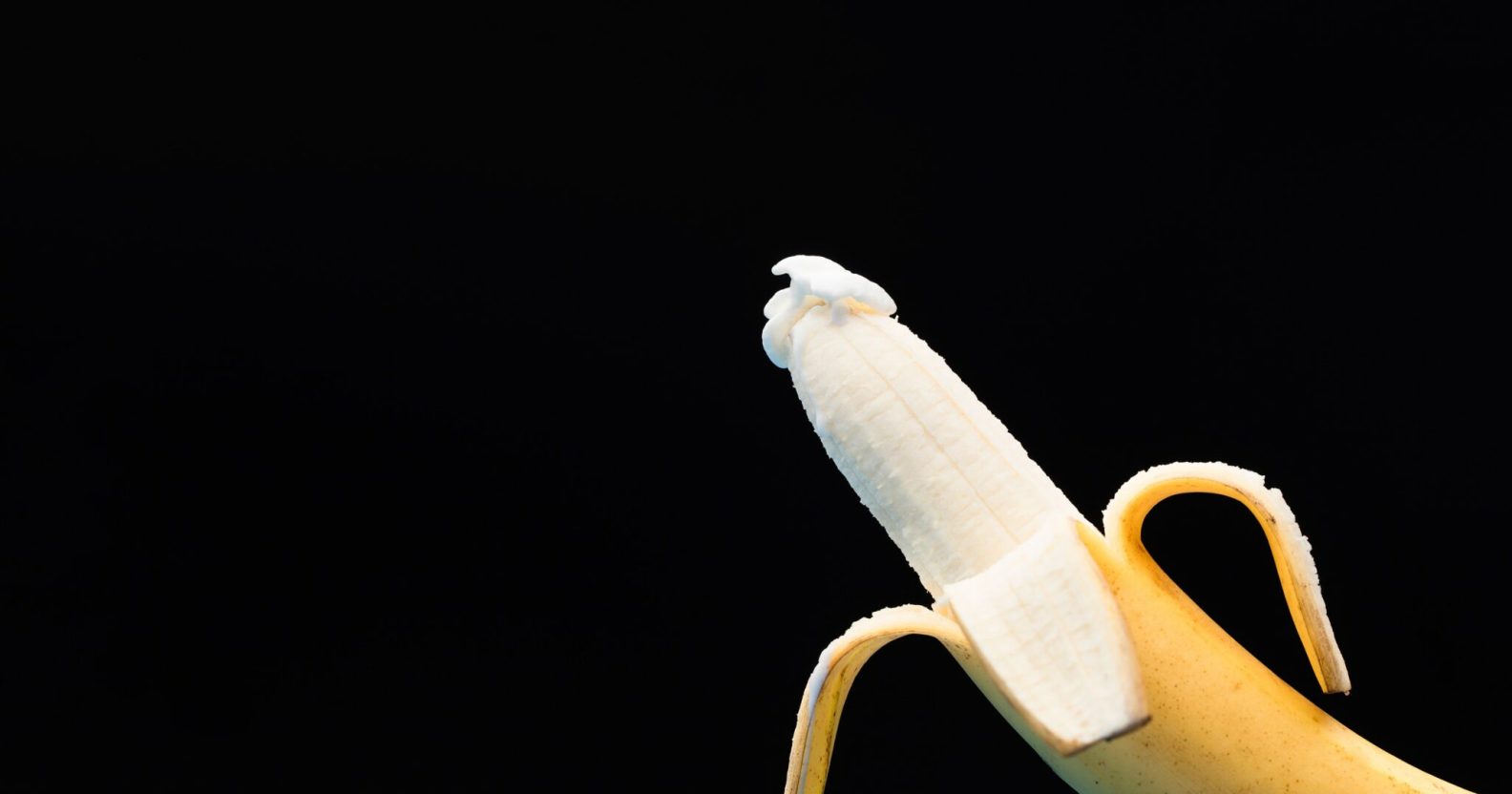 A banana, half peeled