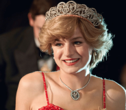 Emma Corrin as PRincess Diana in a red strappy dress, bouffant hair and tiara
