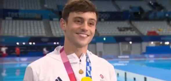Tom Daley with his Olympic medal round his neck
