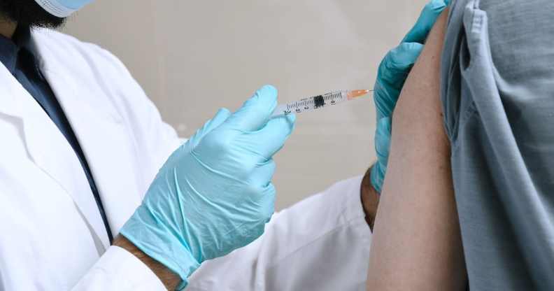 Doctor injects person with a vaccine for HIV