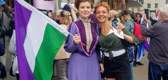 Anti-trans protesters who booed Nicola Sturgeon pose in suffragette colours