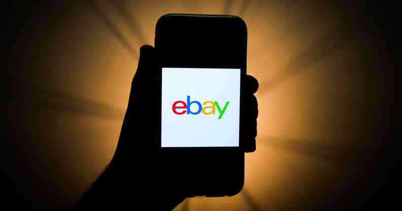 A mobile phone showing the eBay logo