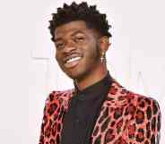 Lil Nas X attends the Tom Ford AW/20 Fashion Show at Milk Studios in gorgeous pink cheetah or leopard print outfit