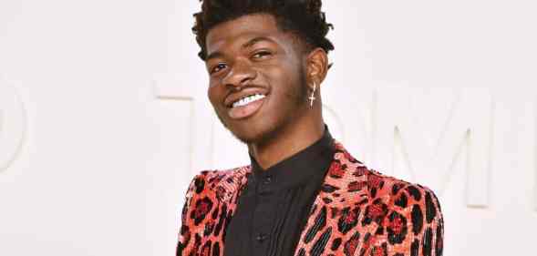 Lil Nas X attends the Tom Ford AW/20 Fashion Show at Milk Studios in gorgeous pink cheetah or leopard print outfit