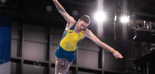 Dominic Clarke jumps with outstretched arms at the Tokyo 2020 Olympics