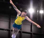 Dominic Clarke jumps with outstretched arms at the Tokyo 2020 Olympics