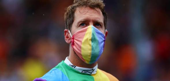 Sebastian Vettel wears a rainbow coloured shirt and face mask at the F1 Grand Prix of Hungary