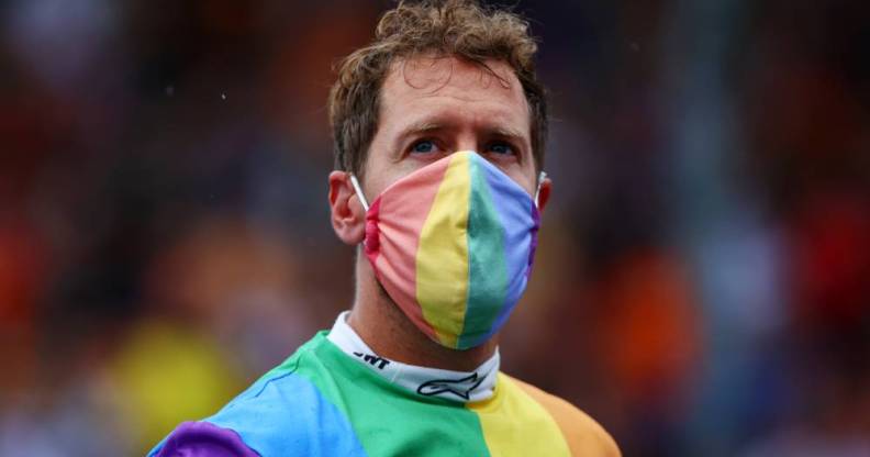 Sebastian Vettel wears a rainbow coloured shirt and face mask at the F1 Grand Prix of Hungary
