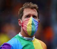 Sebastian Vettel wears a rainbow coloured shirt and face mask at the F1 Grand Prix of Hungary