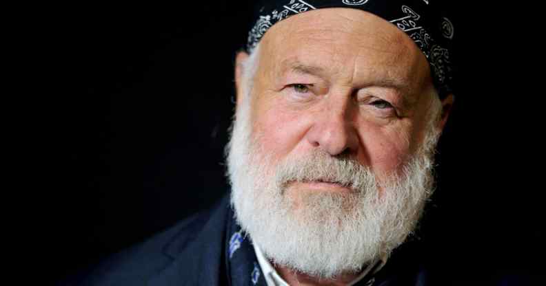 Photographer Bruce Weber in a white shirt and blue blazer