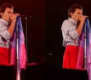 Harry Styles holds a bi Pride flag on stage