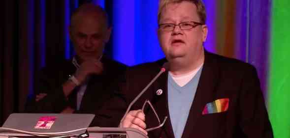 Lars Gårdfeldt speaking on stage