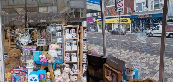 Photographs of a storefront with the windows shattered