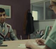Anwar, a character from Netflix's Sex Education, sits across from a nurse at a sexual health clinic who gives him a lesson about HIV