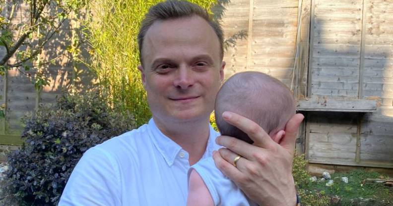 Just Like Us chief executive Dominic Arnall holding his child