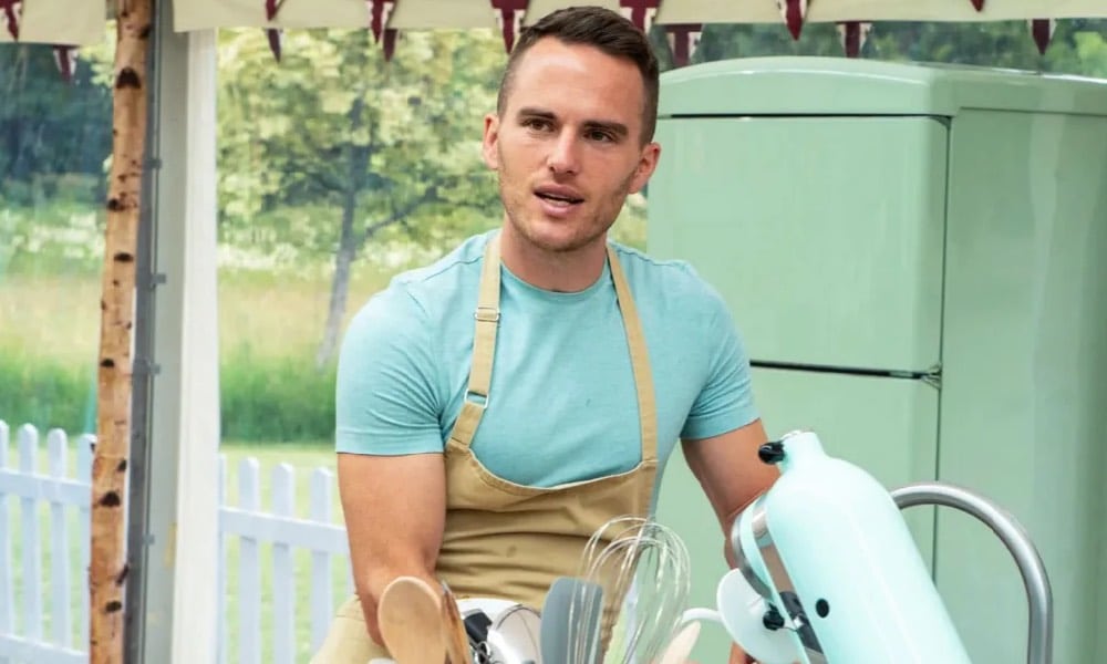 David in the Bake Off tent, in front of a stand mixer