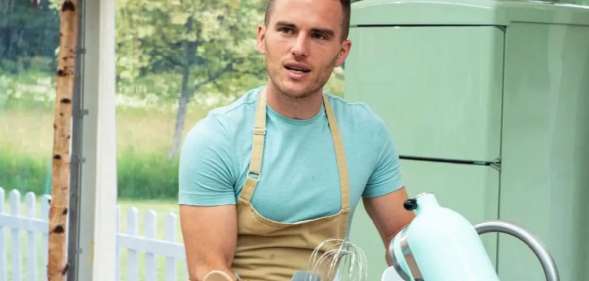 David in the Bake Off tent, in front of a stand mixer