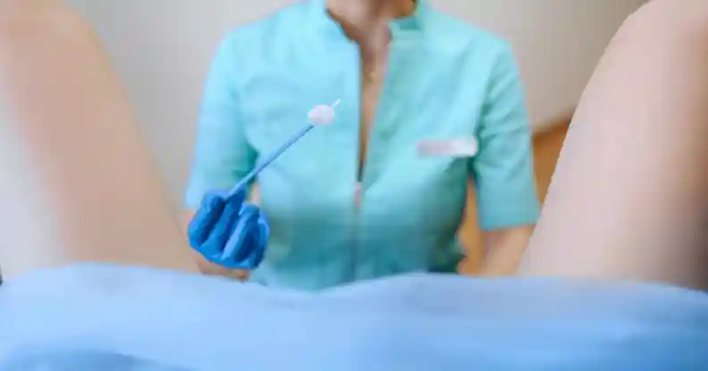 nurse performs cervical screening on person with cervix