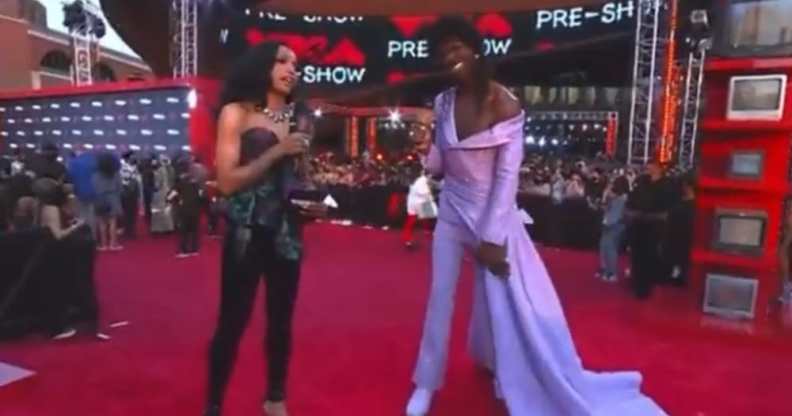 Lil Nas X in a lilac gown and MTV's red carpet host Jamila Mustafa