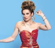 Veronica Green, a drag queen in a red dress with her hair piled on top of her head