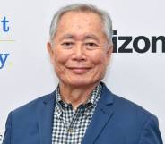 George Takei attends PFLAG conference in blue suit jacket and patterned shirt