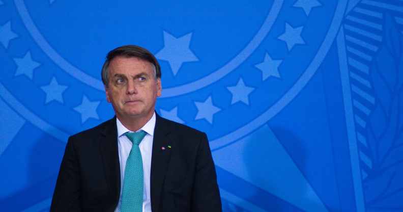 President of Brazil Jair Bolsonaro leans