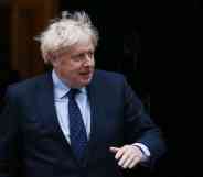 Boris Johnson walks out the door of Number 10