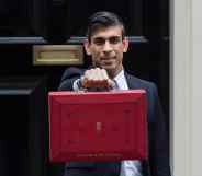 Chancellor of the Exchequer Rishi Sunak holds the Budget box outside 11 Downing Street in central London