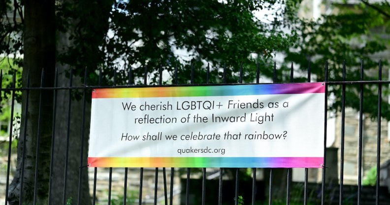 A banner to welcome LGBT+ visitors at a Quaker meeting house in Washington, DC.