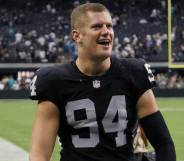 Carl Nassib of the Las Vegas Raiders celebrates as he walks off the field after the team's victory over the Miami Dolphins