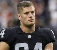 Carl Nassib exits the field after the Las Vegas Raiders lost to the Chicago Bears