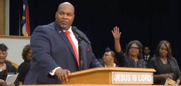 North Carolina's lieutenant governor Mark Robinson is seen speaking before people gathered at the Upper Room Church of God in Christ in August