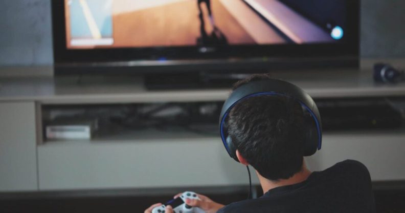 A teenager plays video games