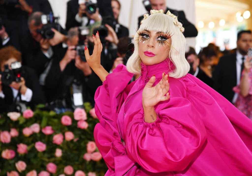 Lady Gaga in a cerise dress at the Met Gala in 2019