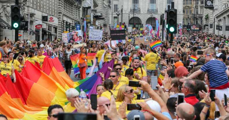 Huge crowd of participants with rainbow colours during the parade. The biggest ever, Pride In London parade in central London.