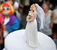 Two female cake-toppers on wedding cake