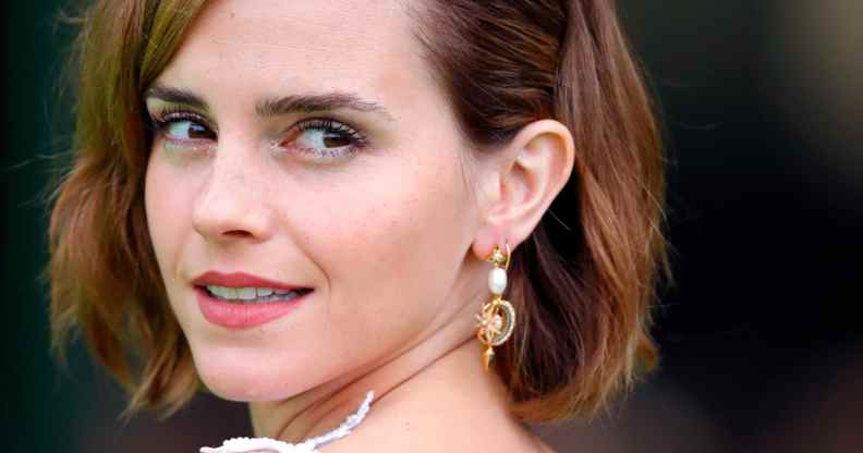 Emma Watson turns to the side and smiles